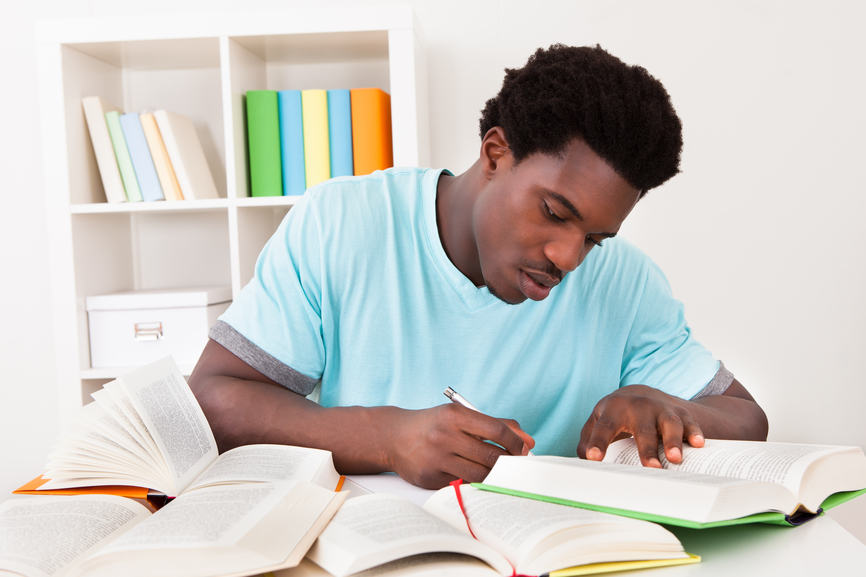 Young African Man Studying